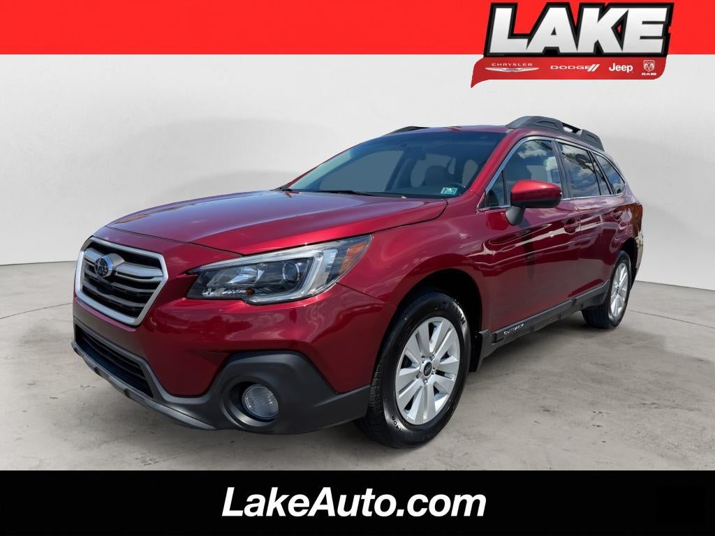 2018 Subaru Outback Premium in Crimson Red Pearl — front three-quarter view